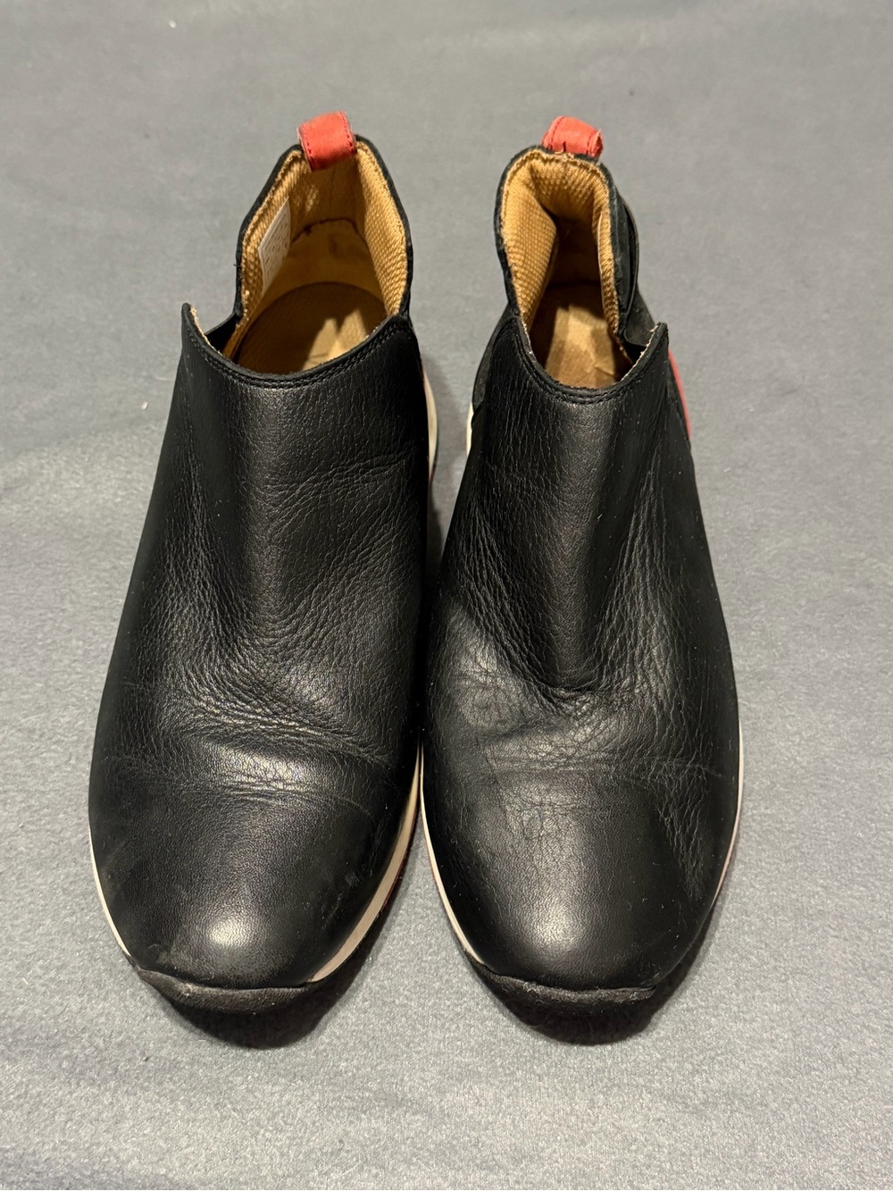 Vionic Cece Black Slip-On Leather Sneakers with Red Pull Tabs